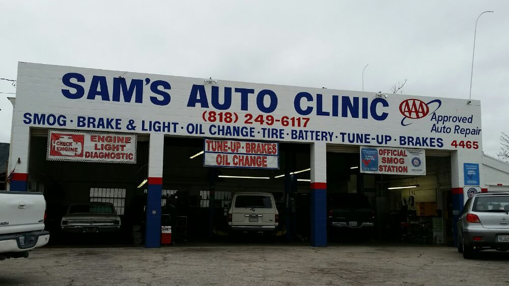 The open service bays at Sam's Auto Clinic on Ramsdell Avenue